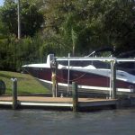 White and dark red boat