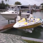 White boat and yellow boats