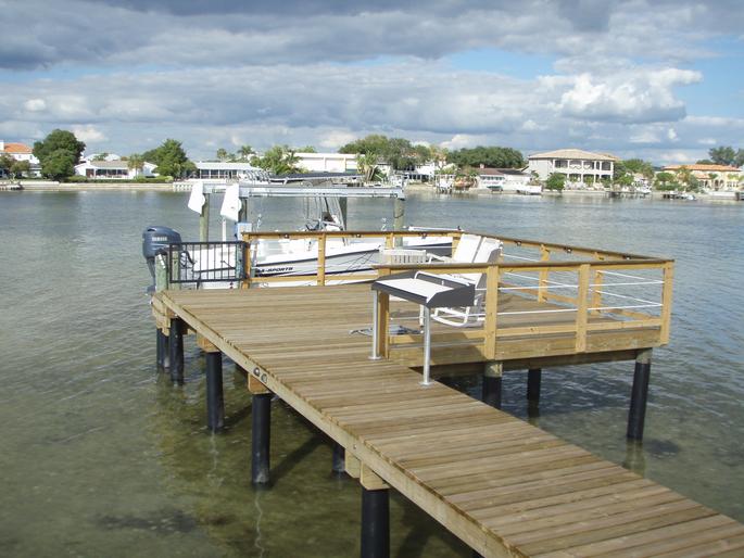 Wooden dock with black posts
