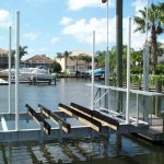 Boat lift hovering above water