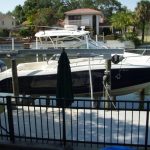 Metal railing by docked boat