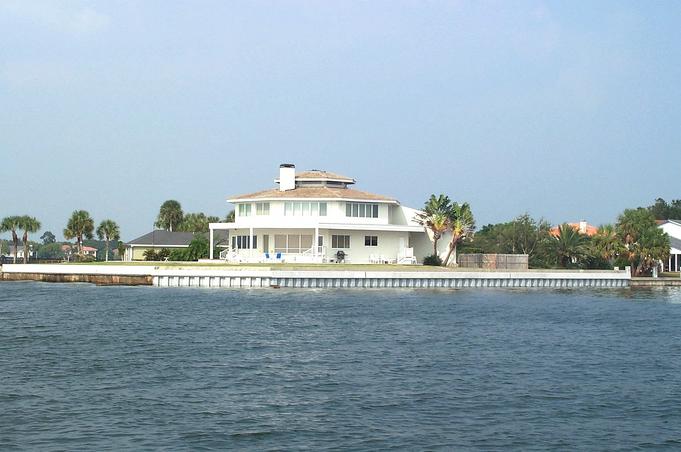 Cylindrical house near sea wall